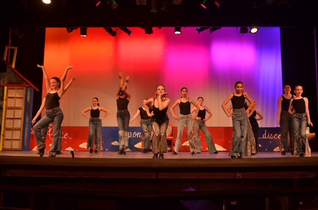 DSC_7937 – Long Lake Camp For The Arts Teen campers performing a coordinated dance sequence on stage