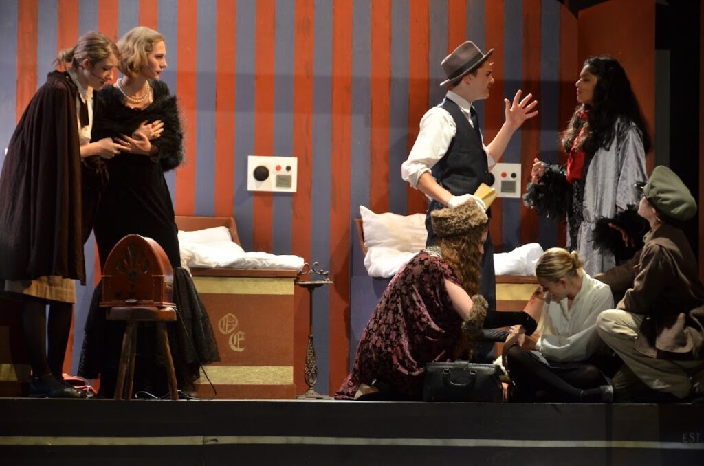 DSC_6541 – Long Lake Camp For The Arts Teens performing a dramatic scene from Murder on the Orient Express on stage
