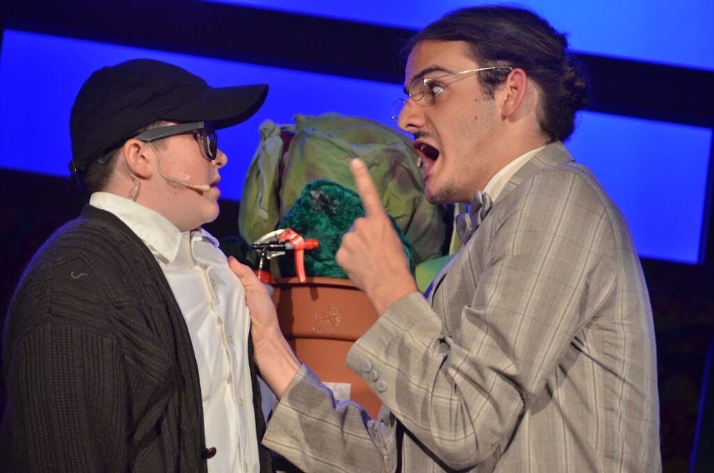 DSC_7516 – Long Lake Camp For The Arts Campers acting in an intense scene from Little Shop of Horrors on stage