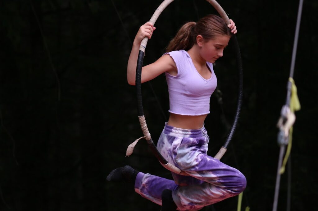 IMG_4577 – Long Lake Camp For The Arts Teen camper performing circus tricks during a summer camp activity