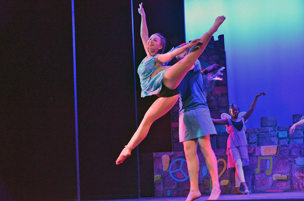 Picture26 – Long Lake Camp For The Arts Teen campers performing a choreographed dance sequence on stage