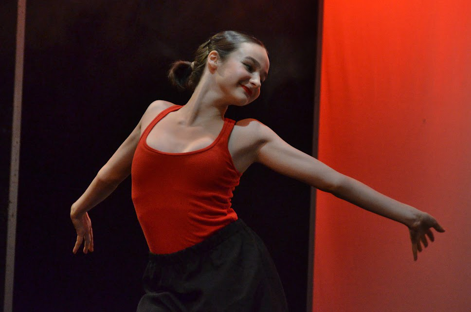Picture5 – Long Lake Camp For The Arts A teen dancer expressing emotion through movement during a solo stage performance