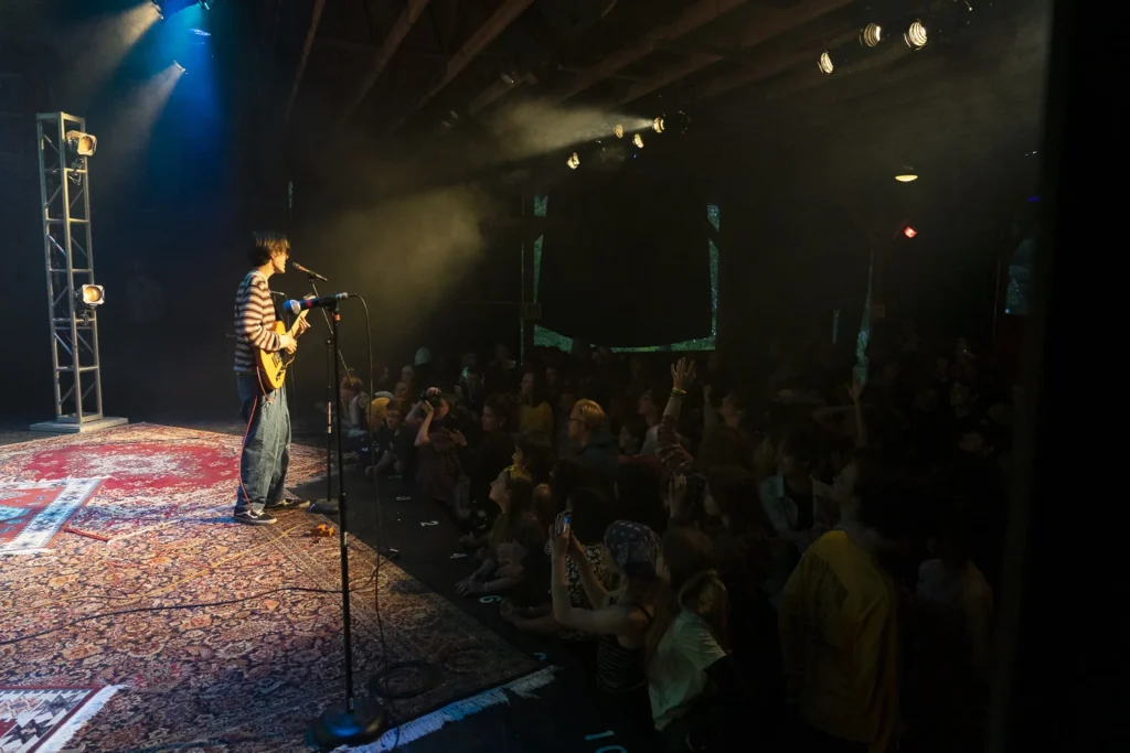 0010_Hayden_RockNight2_0019_Export – Long Lake Camp For The Arts Teen camper performing live on stage during rock night in front of an audience