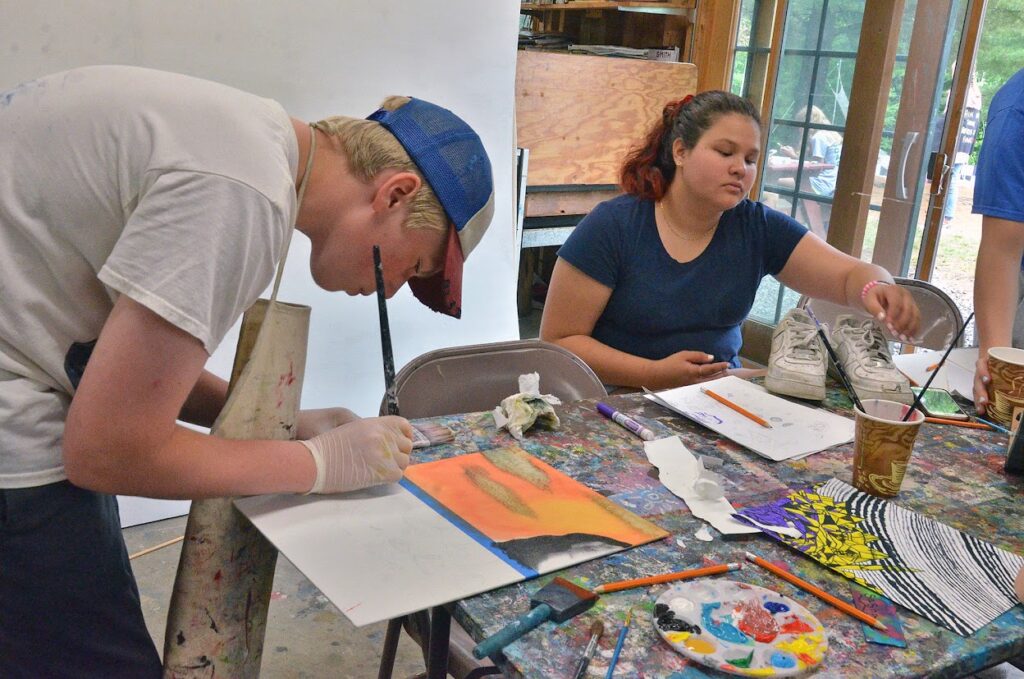 DSC_4330 – Long Lake Camp For The Arts Teen camper enjoying a creative arts activity during summer arts camp