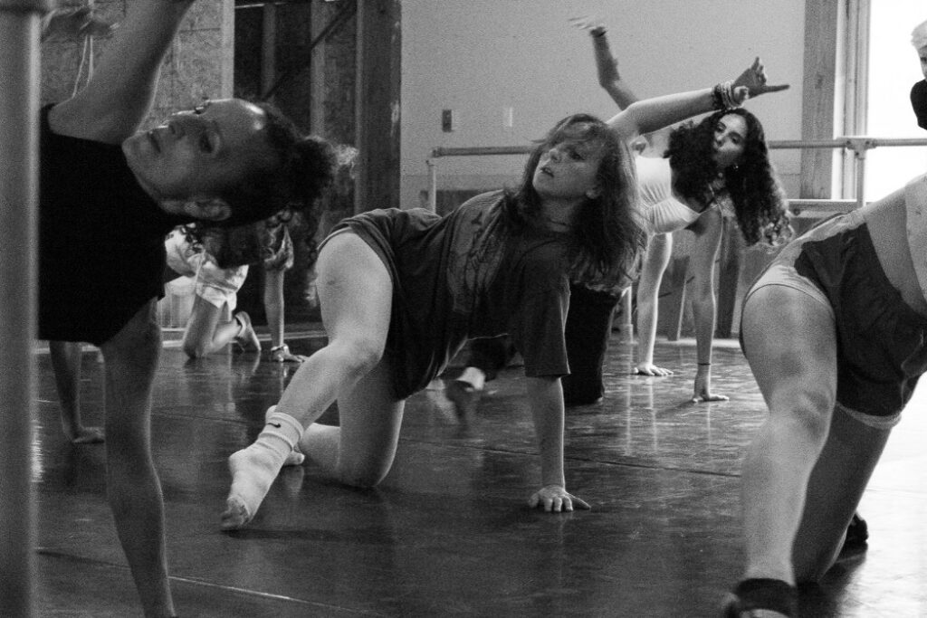 Picture1 – Long Lake Camp For The Arts Campers practicing a dance routine in sync with guidance from an instructor.