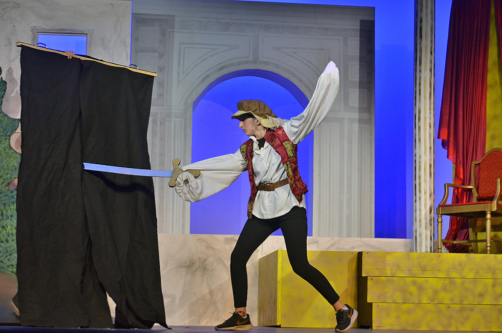 Picture48 – Long Lake Camp For The Arts A teenager performing on stage