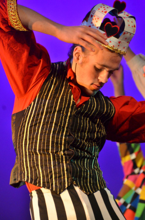 Picture98 – Long Lake Camp For The Arts Camper wearing a stage costume while performing a dance routine during a summer dance camp recital.