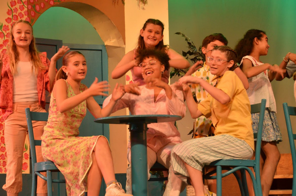 Picture22 – Long Lake Camp For The Arts Campers performing a scene from Mamma Mia on stage