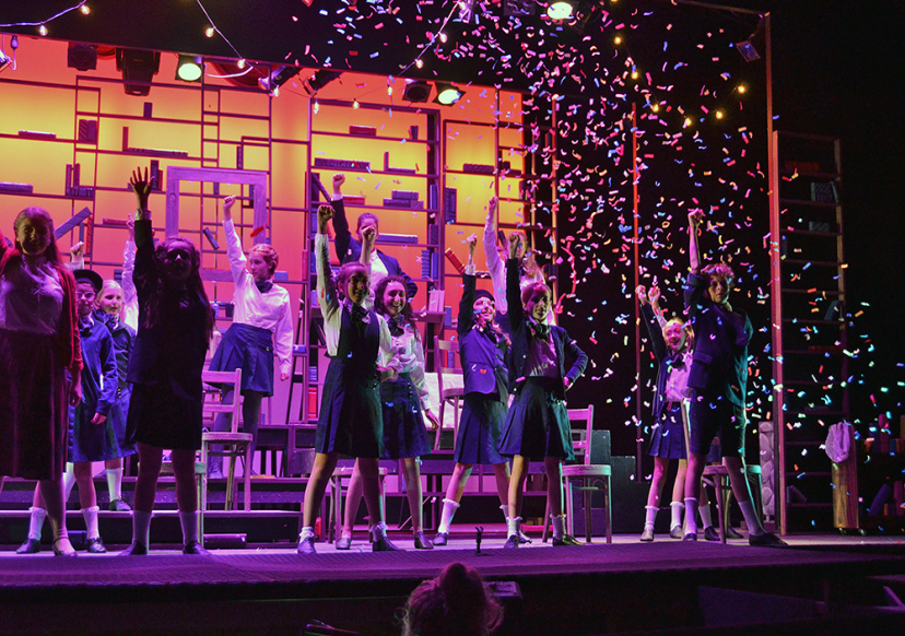 Picture28 – Long Lake Camp For The Arts Campers celebrating on stage with confetti after a successful live performance.