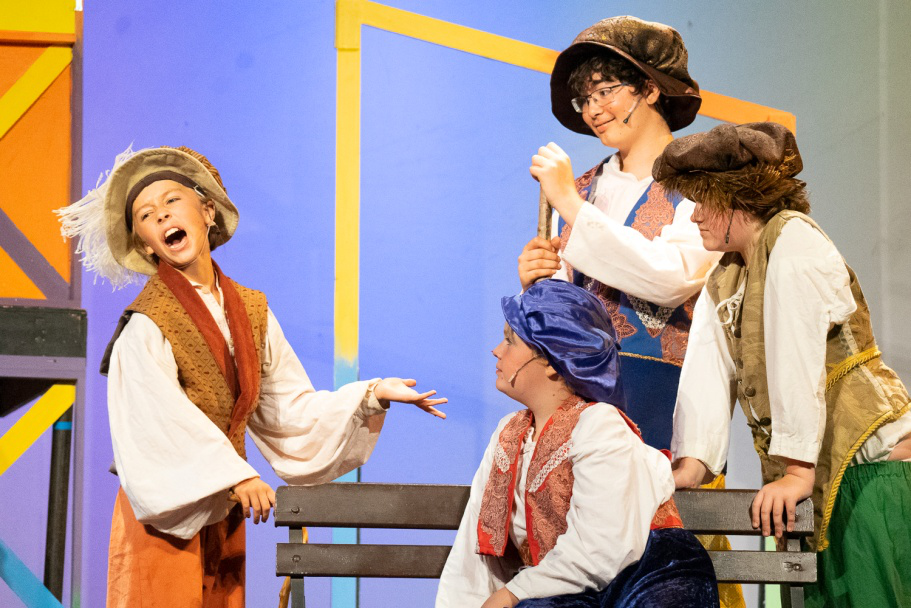 Picture29 – Long Lake Camp For The Arts Campers performing Scapin on stage during a theatre performance at summer camp.