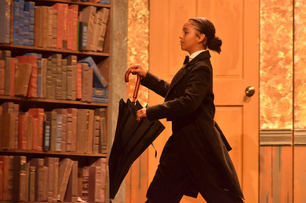 Camper performing in character during a production of Clue at a theater camp in New York.