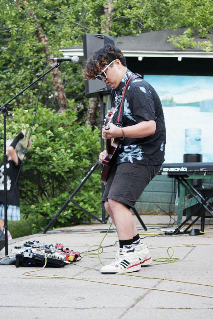Picture10 – Long Lake Camp For The Arts Teen camper playing electric guitar at an arts camp