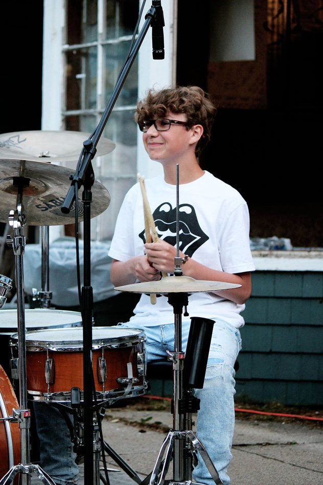 Picture11 – Long Lake Camp For The Arts Teen camper playing drums during a music session