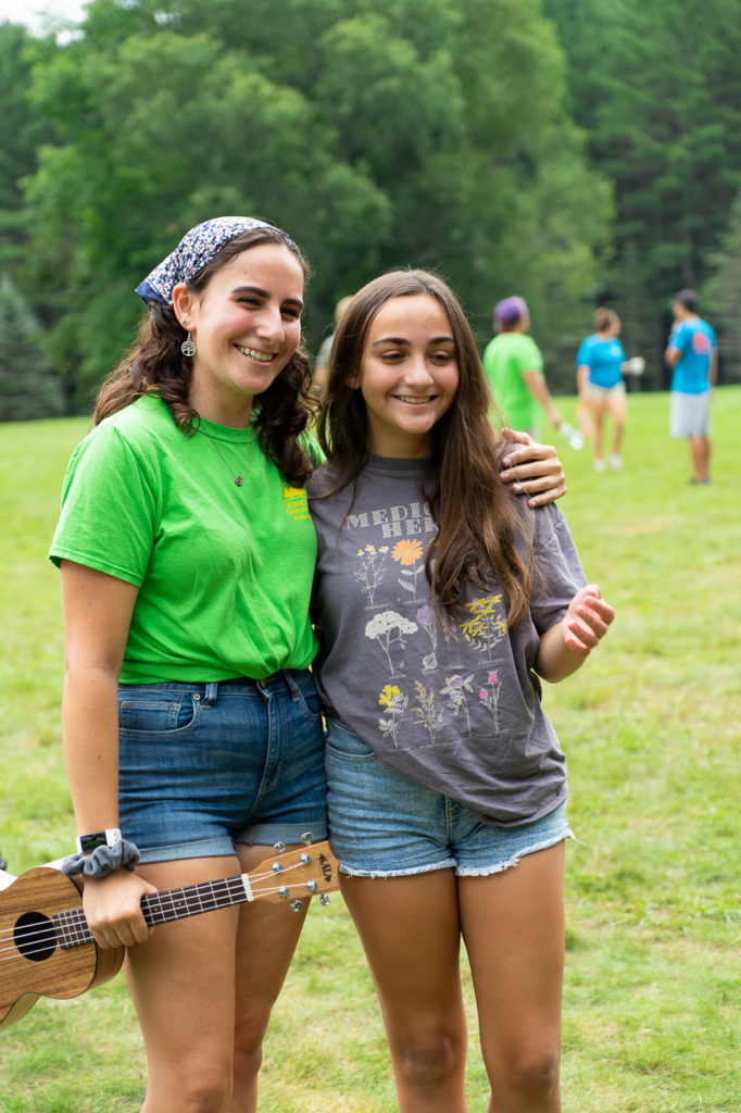 Two sisters spend time together at Long Lake Camp for the Arts during their summer session.