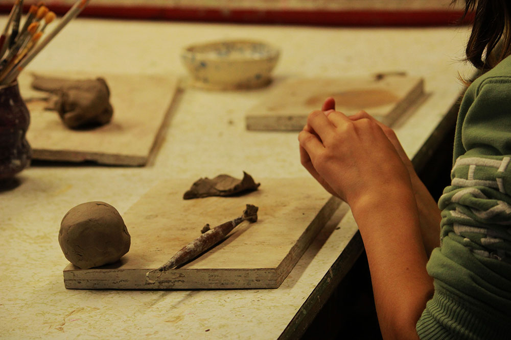 Picture21 – Long Lake Camp For The Arts Young campers working with clay during a ceramics class at Long Lake Camp for the Arts