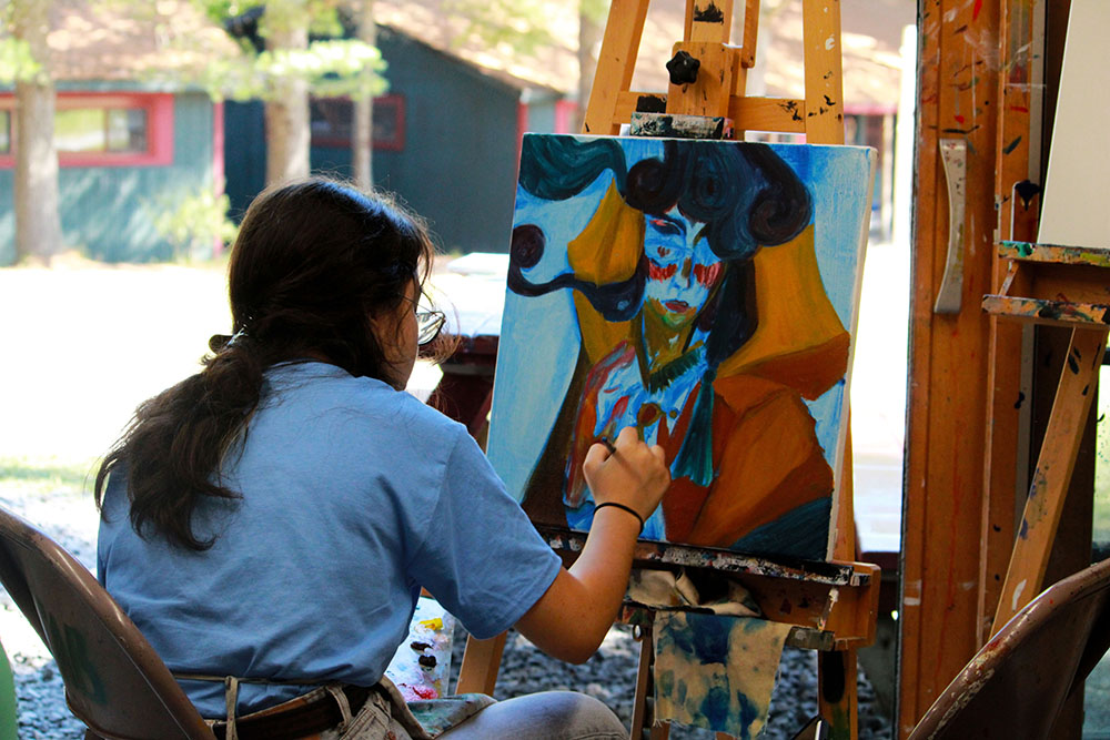 Picture22 – Long Lake Camp For The Arts Camper creating artwork during a hands-on arts camp activity