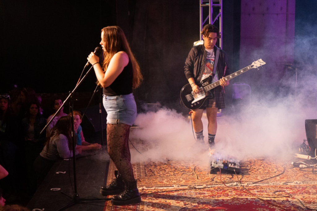 Picture23 – Long Lake Camp For The Arts Teen campers performing live on stage during rock night in front of an audience